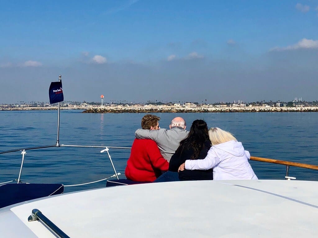 Family together during a funeral on luxury yacht in Huntington Harbour